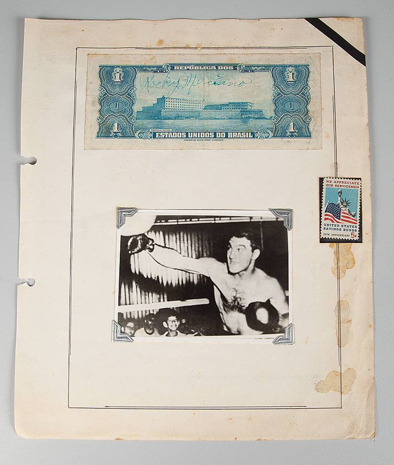 Foto de Rochy Mauriciano medindo 8 x 11 cm., com nota de 1 cruzeiros dos Estados Unidos da América assinada.